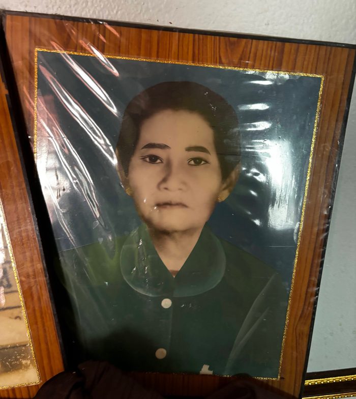 Framed portrait photographed through glare